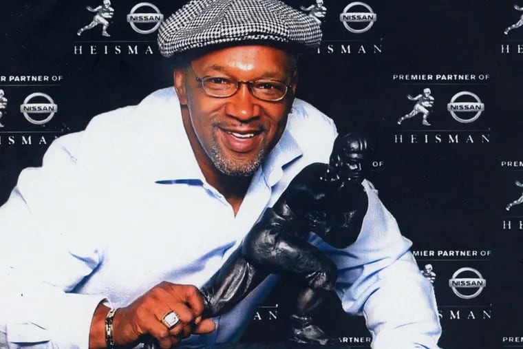 Mike Rozier and the Heisman Trophy.