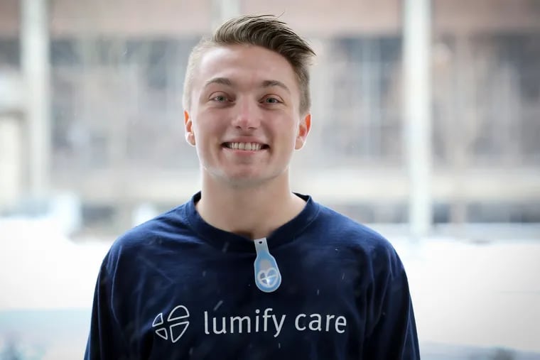 Anthony Scarpone-Lambert, 21, a University of Pennsylvania School of Nursing student, co-invented a wearable light, which he's wearing, that nurses can use to better care for patients at night.