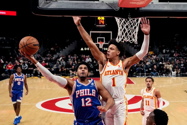 76ers' Tobias Harris goes in for a shot as Hawks' Jalen Johnson defends during the first half on Jan. 10 in Atlanta.
