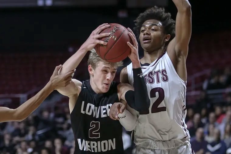 Lower Merion's Jack Forrest drives on Abington's Xavier Monroe during 2nd quarter of District 1 Class 6A boys' basketball semifinals at the Liacouras Center, Tuesday, February 27, 2017.