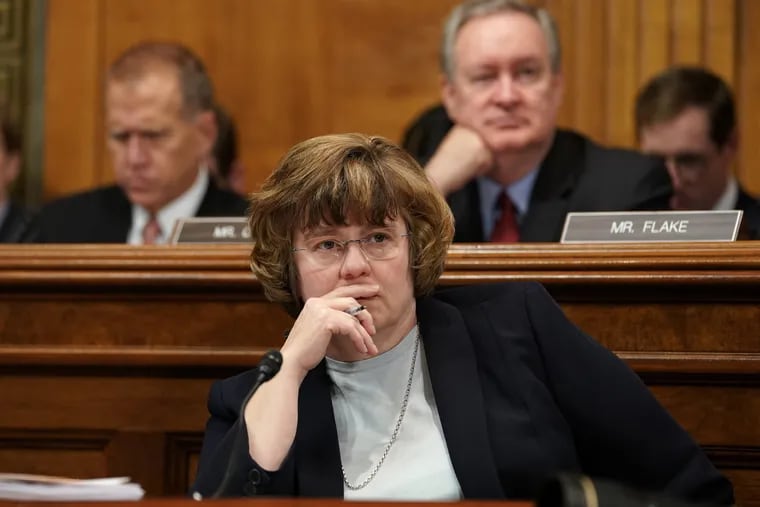 Phoenix prosecutor Rachel Mitchell listens to Christine Blasey Ford testify before the Senate Judiciary Committee on Capitol Hill in Washington, Thursday, Sept. 27, 2018.