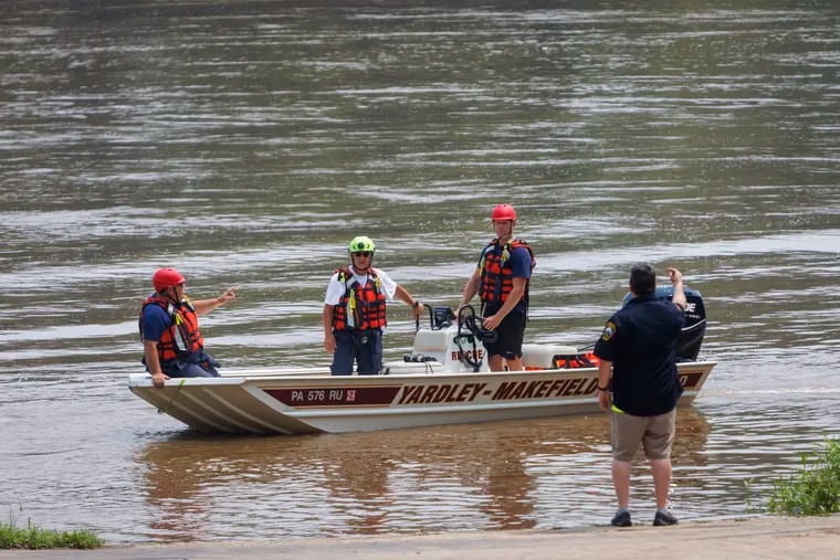 Yardley-Makefield Marine Rescue workers at the Yardley Boat Ramp near River Road as the search continued Monday morning for the missing children.