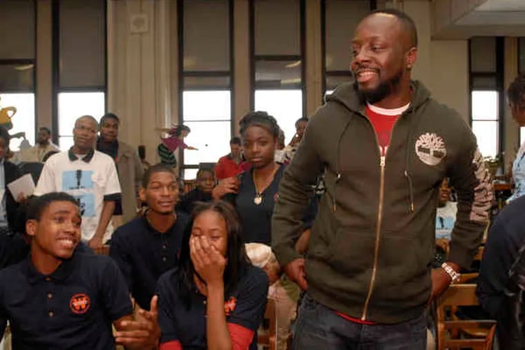 Musician and humanitarian Wyclef Jean talks with students at West Philadelphia High School about community service. His appearance was part of the Big Serve community initiative sponsored by various groups.