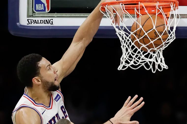 Sixers guard Ben Simmons dunks during a game against the Toronto Raptors.