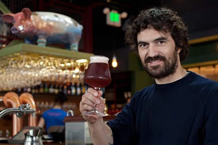 Giovanni Campari, brewmaster of Italy’s Del Ducato, raises a glass of Belgian Oud Beersel at Alla Spina. “Beer-making,” he says, “is my way to express myself.” DAVID M WARREN / Staff Photographer