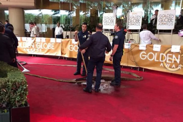 Several photos of the disgusting spill were posted to Twitter by the likes of Ryan Seacrest and Cosmopolitan magazine. "Huge water leak on #goldenglobes red carpet...Bev Hills fire trying to clean up," Seacrest tweeted at about 5 p.m. (Photo: Ryan Seacrest via Twitter)