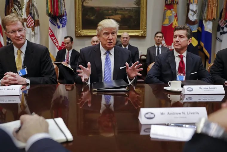 Johnson &amp; Johnson CEO Alex Gorsky (at right), with President Trump at a January breakfast of  business leaders in the Roosevelt Room of the White House.