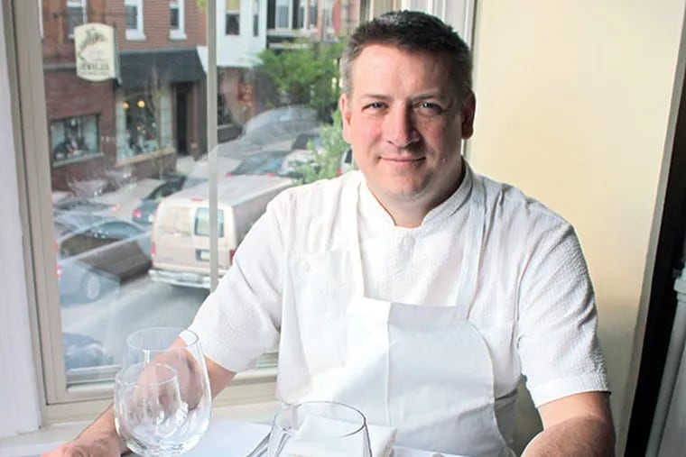 Chef Townsend "Tod" Wentz in the window seat of his new restaurant, Townsend, at 1623 E. Passyunk Ave.   (MICHAEL KLEIN / Philly.com)
