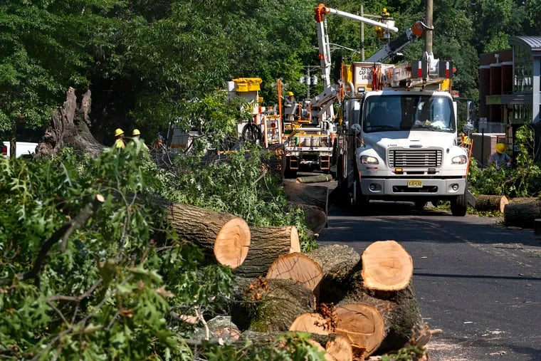 Utility crews from PSE&G are still at work in Haddonfield on July 6  after ‘Microbursts’ pounded South Jersey. More storms are due Friday and Sunday.