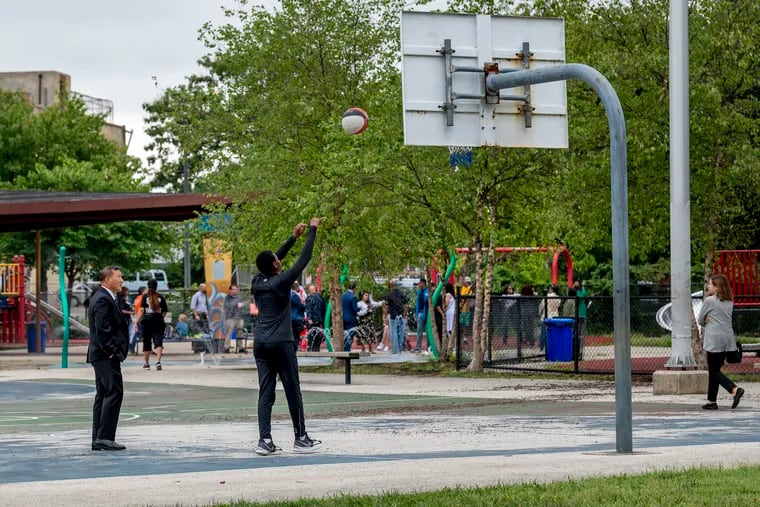 Zair Barnes, 13, shoots hoops at the Mander Playground in Strawberry Mansion last year, before former Gov. Tom Wolf arrived for an event to announces the opening of two violence intervention programs.