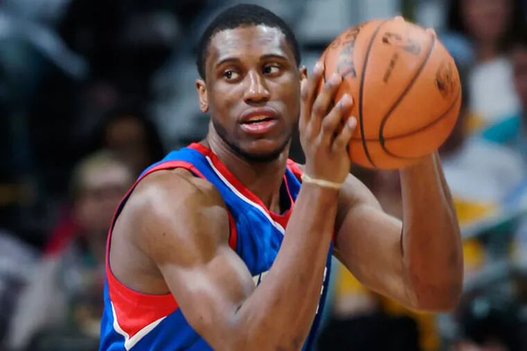 Thaddeus Young, right, looks to pass the ball as Denver Nuggets forward Kenneth Faried defends during the third quarter of the Sixers' 114-102 victory in an NBA basketball game in Denver on Wednesday, Jan. 1, 2014. (David Zalubowski/AP)