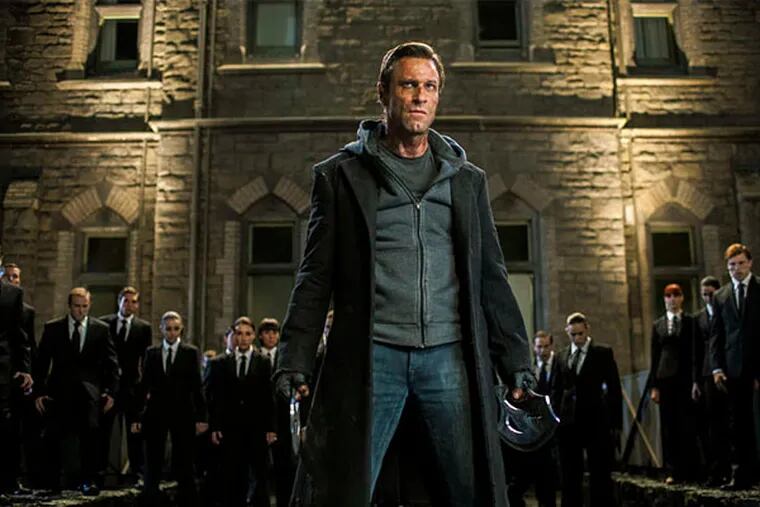 Aaron Eckhart is the reanimated monster in a hoodie.