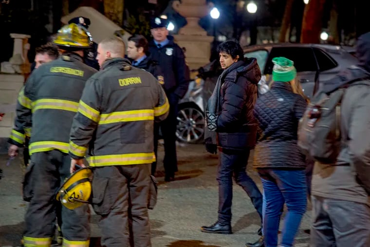 M. Night Shyamalan (center) is on the set of a psychological thriller series he is directing for Apple TV called Crumpet, filming in Rittenhouse Square December 4, 2018.