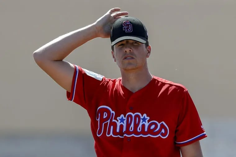 Phillies pitcher Nick Pivetta adjust his cap after giving up a first-inning home run to Curtis Granderson.