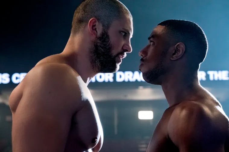 This image released by Metro Goldwyn Mayer Pictures / Warner Bros. Pictures shows Florian Munteanu , left, and Michael B. Jordan in a scene from "Creed II."  (Barry Wetcher/Metro Goldwyn Mayer Pictures/Warner Bros. Pictures via AP)