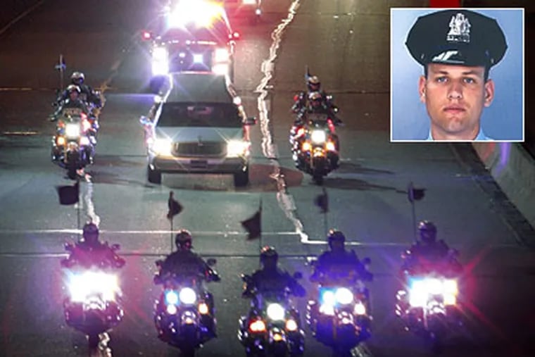 Philadelphia police escort the body of Officer John Pawlowski (inset), who was shot while on duty at Broad Street and Olney Avenue. Pawlowski was taken to Albert Einstein Medical Center, where he was pronounced dead. (AP)