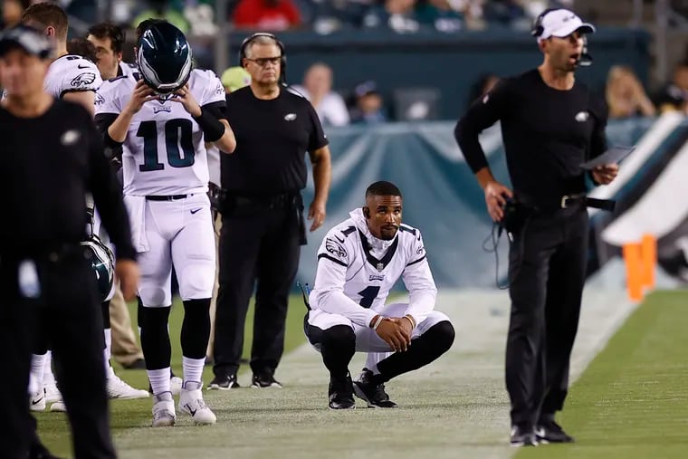Eagles quarterback Jalen Hurts watches his teammates take on the Pittsburgh Steelers after he left the preseason game at Lincoln Financial Field on Thursday.