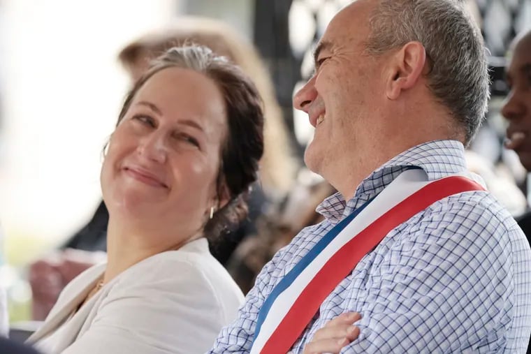 Bordentown Mayor Jennifer Sciortino smiles at Mayor Jacques Fabre of Mortefontaine, a French village, during a Bastille Day celebration.