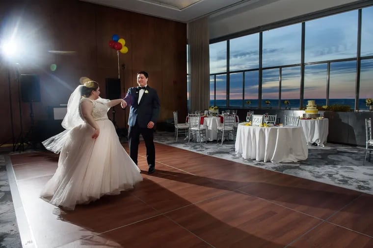 Bride Tina DiSciullo  and her new husband Kyle Acker, do a quick first dance practice prior to their wedding reception Loews Hotel.