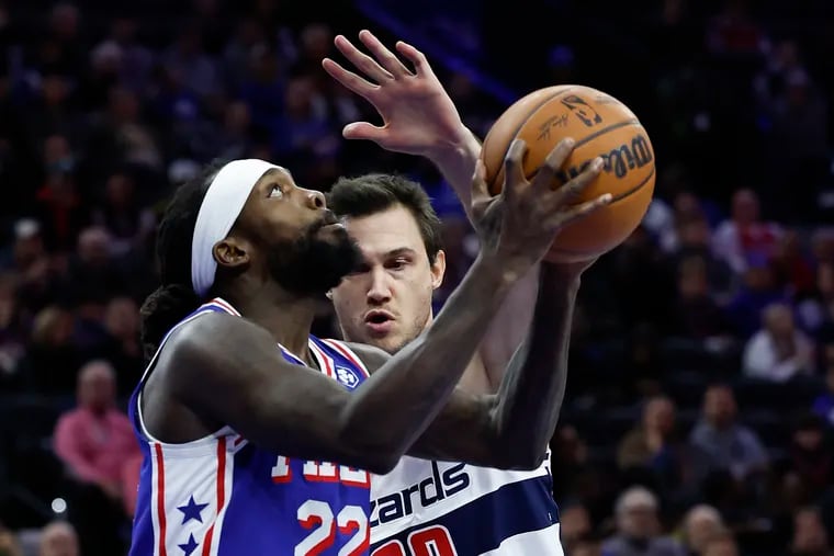 Sixers guard Patrick Beverley goes in for a layup as Washington's Danilo Gallinari defends him on Monday.