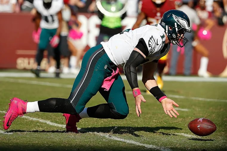 Eagles quarterback Carson Wentz tried to catch a ball that was tipped.
