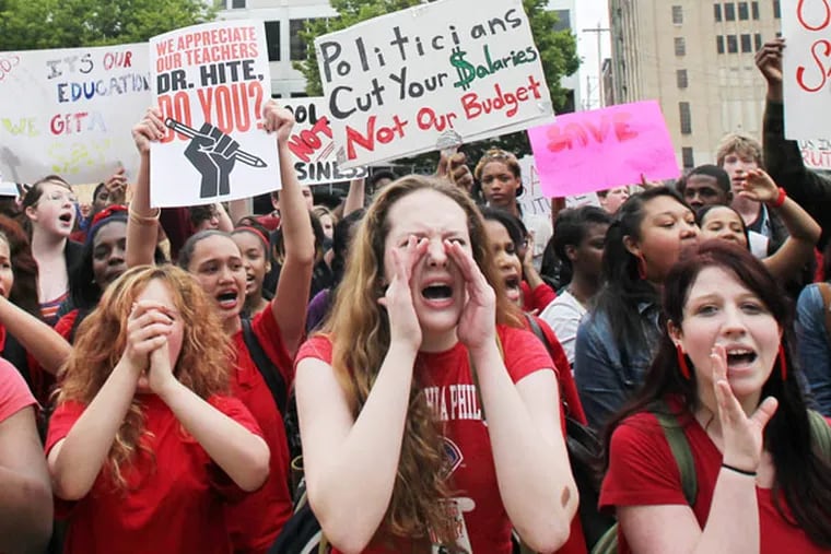High school students chant at the Philadelphia School District headquarters on North Broad Street to protest budget cuts on Tuesday, May 7, 2013. (Yong Kim / Staff Photographer)
