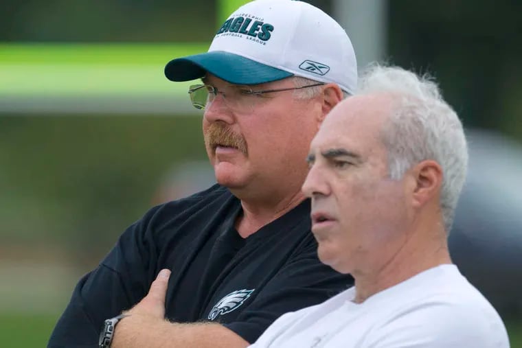 Eagles owner Jeffrey Lurie (right) took a gamble on Andy Reid 21 years ago. It turned out to be one of the best decisions he's ever made.