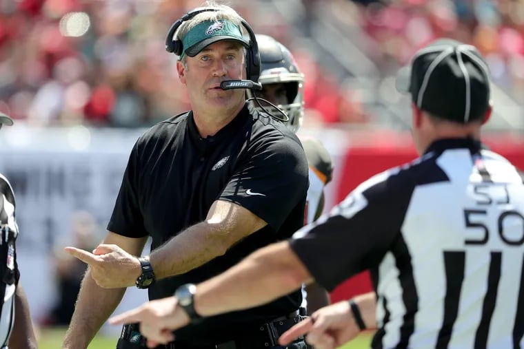 Eagles' head coach Doug Pederson talks to the officials in the 2nd quarter as the Philadelphia Eagles play the Tampa Bay Buccaneers in Tampa, Fl on September 16, 2018. DAVID MAIALETTI / Staff Photographer