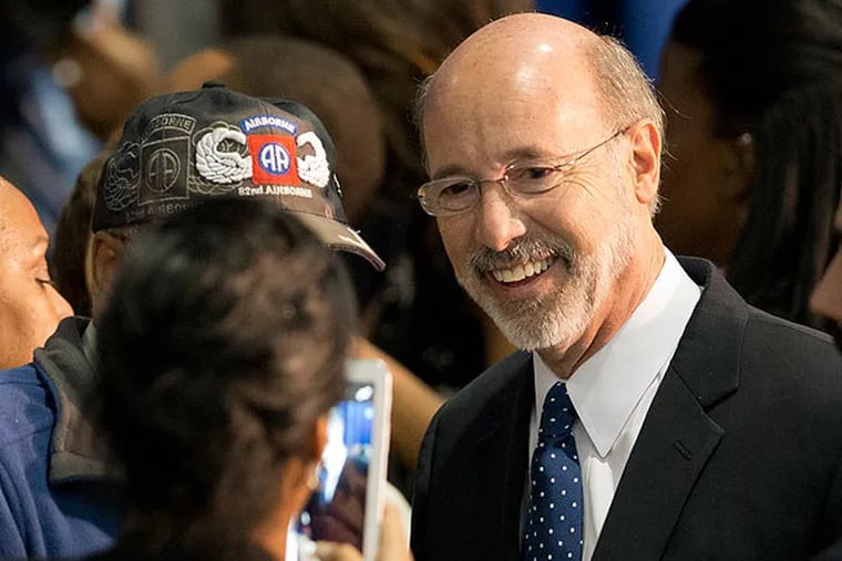 Pennsylvania Democratic gubernatorial candidate Tom Wolf meets with audience members during a rally Wednesday, Oct. 15, 2014, at the Dorothy Emanuel Recreation Center in Philadelphia. (AP Photo/Matt Rourke)