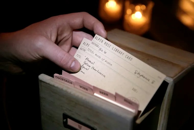 The card catalogue with drinks customized and numbered for regulars sits on the bar at Alpen Rose.