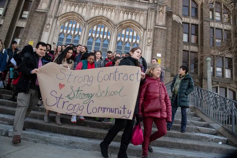 Parents, union members, students and teachers walked around the Aspira Olney Charter High School, during a rally for  'Strong Contract, Strong School, Strong Community" in Philadelphia, Pa. Tuesday, March 19, 2019.