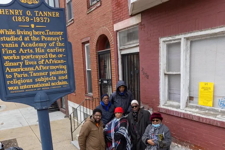 Friends of the Henry Ossawa Tanner house gathered outside the rowhouse at 2908 W. Diamond St. in Philadelphia on Feb. 24, 2022. From left to right, front row, are Christopher Rogers, Judith Robinson, Hasan Roland, and Jacquline Wiggins. On stairs, from left are Kevin Upshur and Salim Ali.