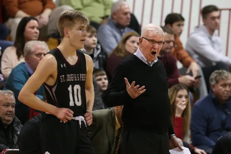 Coach “Speedy” Morris, right, of St. Joseph Prep argues with an official during their game against Archbishop Carroll in a first round Phialdelphia Catholic League game on Feb. 12, 2020. Brian Geatens is left.