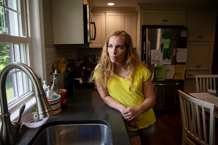 Jodi Cutaiar, 41, of Sellersville, Pa., lives in one of the 11 homes that have contaminated private wells. She, her husband, and her two daughters, ages 8 and 9, have been living on bottled water provided by the state for two and a half years, and they say they want public water.