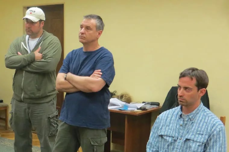 In Russian security service offices in Moscow, Ryan Fogle (right) is shown with U.S. Embassy officials. He was accused of attempting to recruit a Russian official to work as a CIA spy.