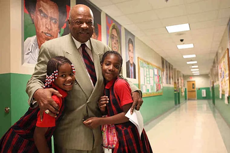 File photo: Founder Walter D. Palmer at the Palmer Leadership Learning Charter with students Azjae Green (left) and Jakhia McLaurin in 2010. The state Supreme Court has ruled in favor of the School Reform Commission over enrollment limits at the charter. (Juliette Lynch/Staff/File)