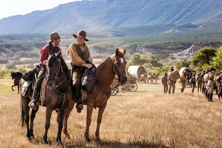 Joaquin Phoenix, left, and John C. Reilly in a scene from 'The Sisters Brothers.'