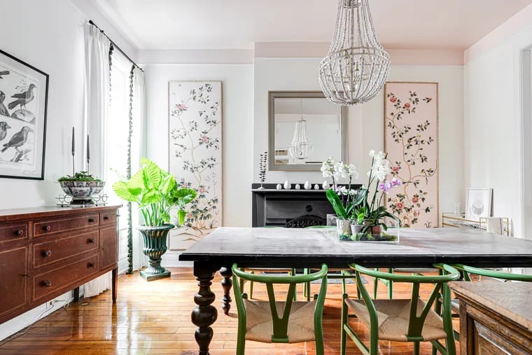 The chinoiserie panels flanking the fireplace in Stevie McFadden's dining room were decor from a black-tie event she attended with friends last spring. She purchased them the next morning after a bit of haggling.