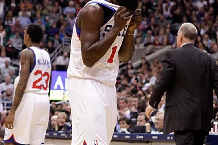 Point guard Jrue Holiday led the Sixers with 22 points in Friday night's loss to the Jazz in Utah. (Jim Urquhart/AP)