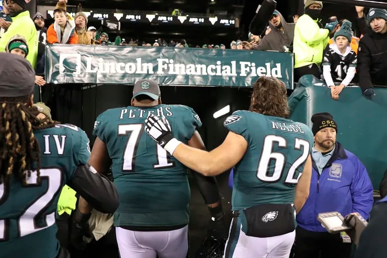 Eagles offensive linemen Jason Peters (left) and Jason Kelce (right) left the field together after the season-ending 17-9 loss to the Seahawks at Lincoln Financial Field.