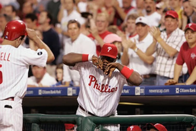 &quot;You have to look at the production of the middle of the lineup, and guys have to pick it up,&quot; says Pat Burrell, being congratulated by Ryan Howard after homering. &quot;I have no problem with that.&quot;
