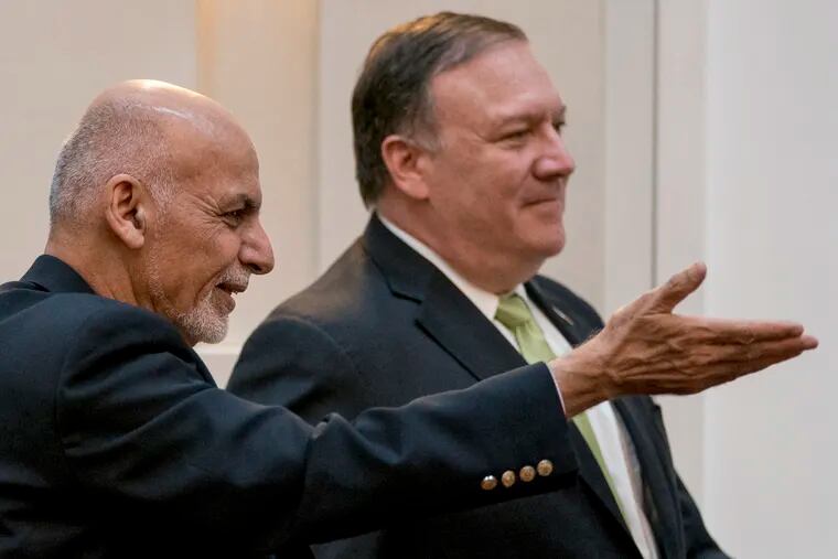 FILE - In this July 9, 2018 file photo, Afghan President Ashraf Ghani, left, and Secretary of State Mike Pompeo, arrive for a news conference in Kabul, Afghanistan. U.S. Secretary of State Mike Pompeo called the Afghan president over the weekend to express disappointment over the indefinite postponement of talks with the Taliban and to condemn the insurgent's latest "spring offensive." The Afghan-to-Afghan talks in Qatar were scheduled to start Friday, April 19, 2019, when they were scuttled after a falling out over who should attend. (AP Photo/Andrew Harnik, Pool, File)