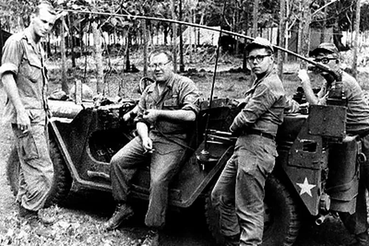 First Lt. John F. Cochrane (left) with three other soldiers in a photo taken during the Vietnam War.