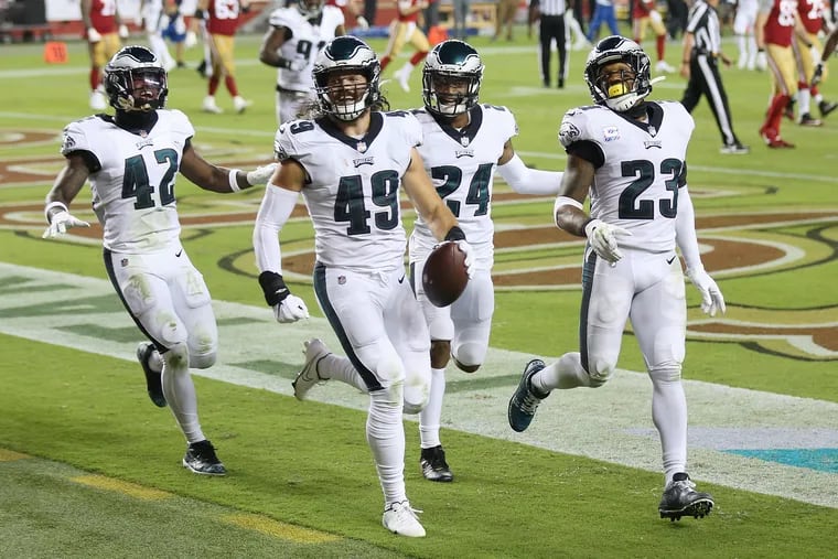 Eagles linebacker Alex Singleton (49) celebrates his fourth-quarter interception and touchdown during the win over the 49ers.