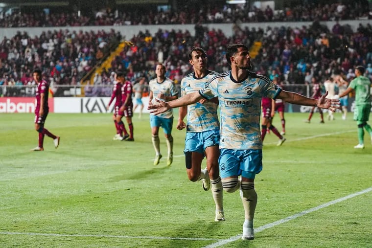 Julián Carranza (right) celebrates one of his three goals in the Philadelphia Union's 3-2 win over Saprissa in the Concacaf Champions Cup first round at the Estadio Ricardo Saprissa Aymá in San José, Costa Rica on Tuesday.