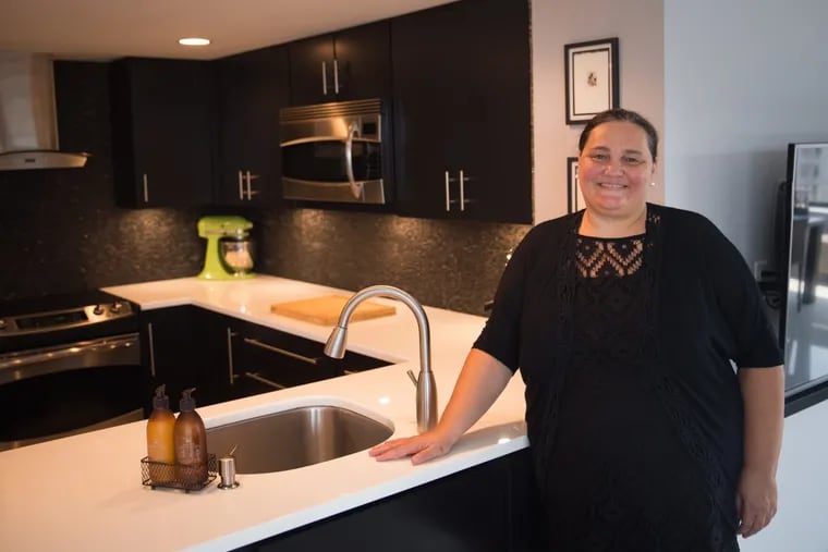 Esther Recio found the services and convenience she wanted when she and husband Maximiliano Visconti downsized from a Victorian in University City to Cityview Condominiums on Hamilton Street.