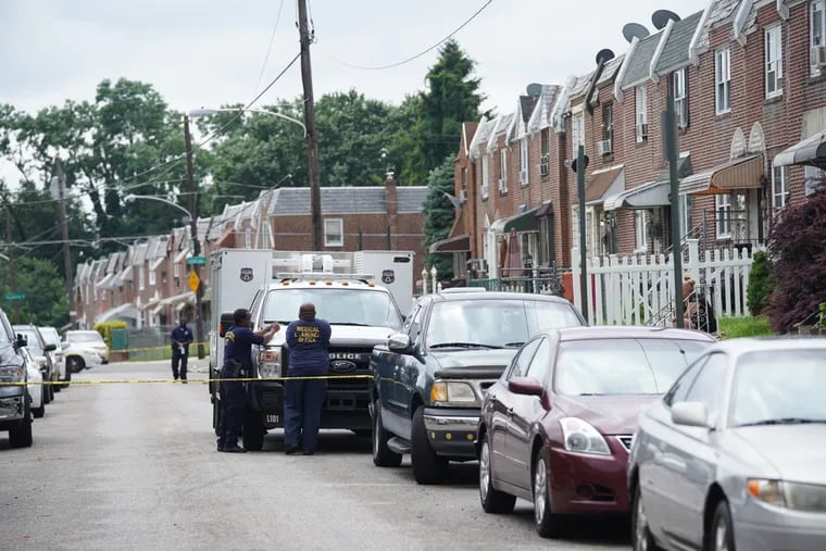 The 4600 block of Weymouth Street in Juniata Park is blocked off with yellow police tape on Monday, July 8, 2019, after a Philadelphia Police officer fatally shot his wife and then himself, police said.