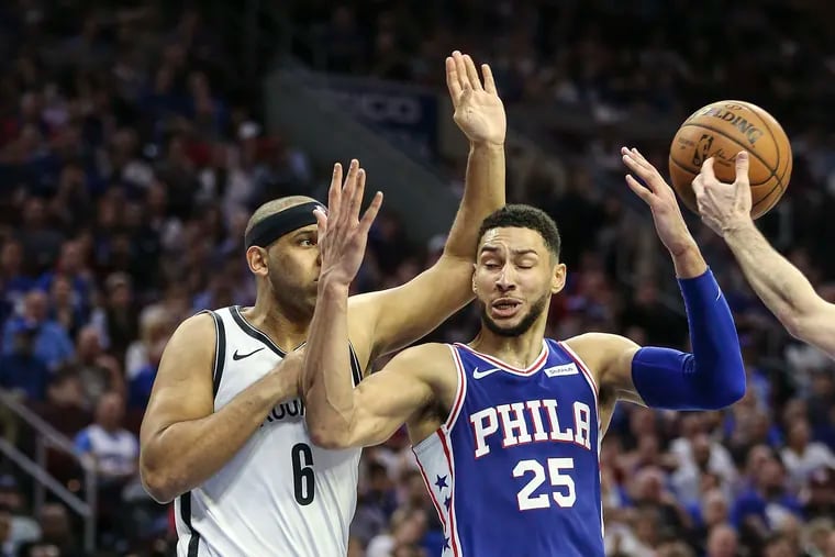 Ben Simmons is fouled by the Nets' Jared Dudley during the fourth quarter of Game 5 Tuesday night.