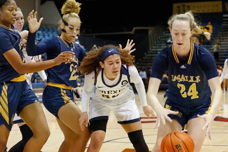 (L-R) La Salle’s # 15 Kayla Spruill, La Salle’s # 22 Jordan Lewis, Drexel’s # 30 Mariah Leonard and La Salle’s #24 Amy Jacobs follow a loose ball in the first half of the La Salle at Drexel University women's NCAA basketball game at Drexel’s Daskalakis Athletic Center in Phila., Pa. on Nov. 17, 2021.