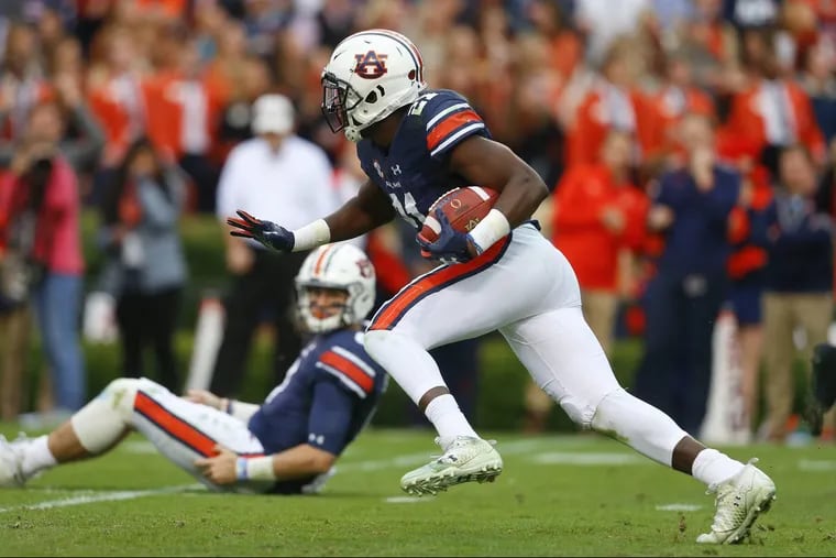 Auburn running back Kerryon Johnson suffered a shoulder injury during the Iron Bowl game against Alabama and is considered to be a game-time decision to play against Georgia in the SEC championship game.